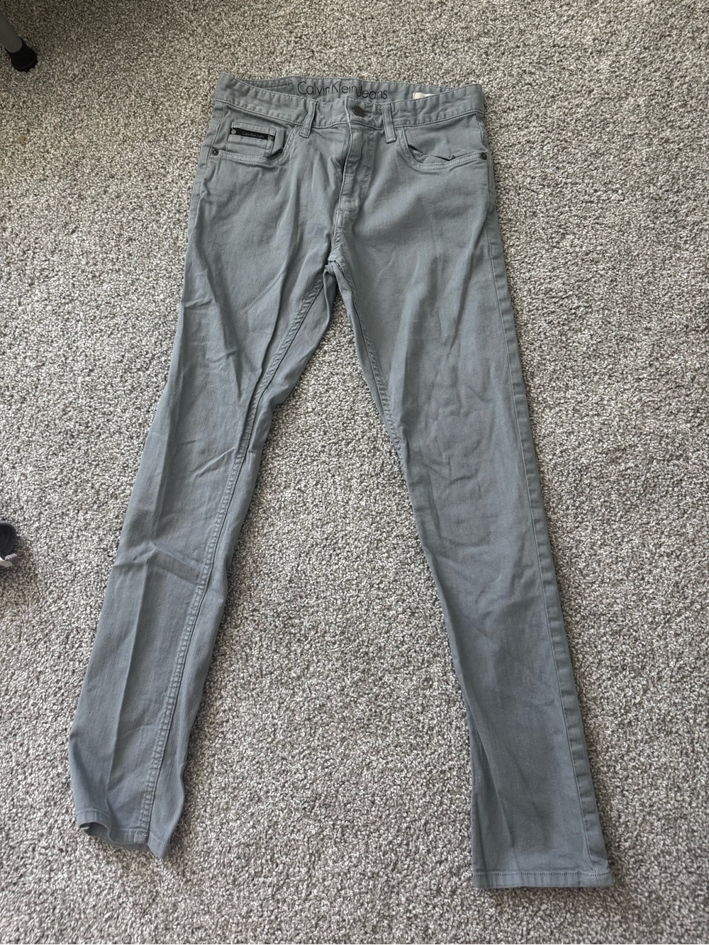 Calvin Klein men’s slim fit jeans in Light Gray